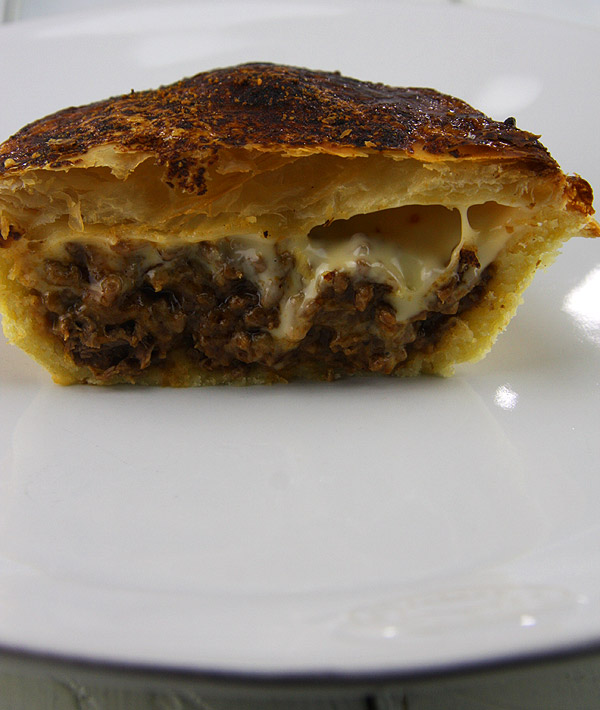 meat pie with melted cheese